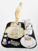 A continental Art Deco ceramic figure of a lady together with two Art Deco plates,