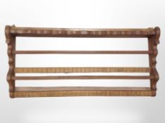 A Scandinavian carved oak coat rack,