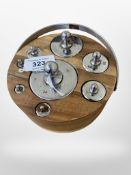 A circular fitted wooden stand, with swing chrome handle,