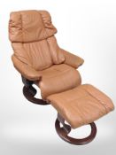 A late 20th century Danish tab stitched leather armchair and matching footstool on beech support