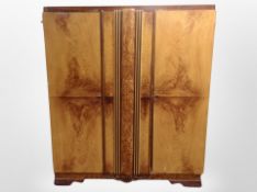 A mid 20th century scummbled pine double door wardrobe,
