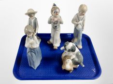 A Nao figure of two dogs, Nao figure of a lady, and three further Spanish figures.