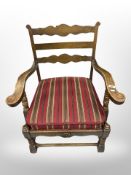 A 20th century Danish carved oak armchair