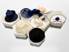 Several hat boxes containing a quantity of lady's formal dress hats.