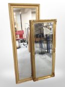 Two rectangular gilt frame mirrors, largest 131cm x 41cm.