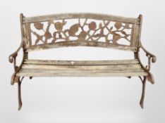 A teak and cast iron garden bench,