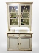 A 19th century Scandinavian painted and gilt pine glazed double door bookcase,