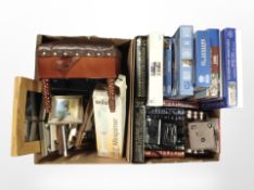 Two boxes containing jigsaws, Reader's Digest leatherbound volumes, picture frames,