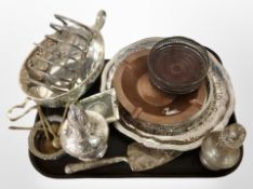 A group of plated ware, including bottle coaster, twin-handled basked, toast rack, large sifter,