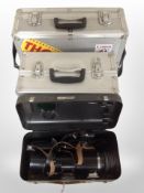 A metal lens case containing Soviet-made camera lens and two further flight cases.