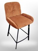 A contemporary high chair on metal support,