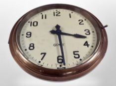 A Gents of Leicester brass cased circular electric timepiece, diameter 23cm.