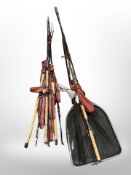 A group of two-piece fishing rods including Daiwa etc, together with a landing net.