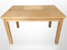 An early 20th century pine kitchen table,