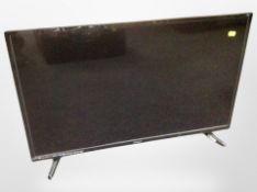 A Poloroid 32 inch LCD TV with lead and remote