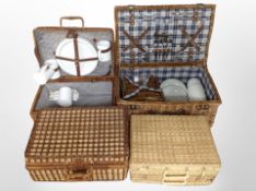 Four wicker picnic hampers, two with part contents.