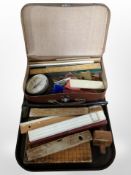 A group of vintage rulers, brass-mounted spirit level by Rabone and Sons, hydrometer,