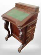 A Victorian-style mahogany Davenport.