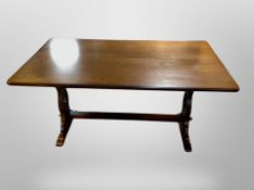 A reproduction oak 5' refectory dining table and four chairs