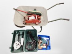 A galvanised wheel barrow, car jack, box of pressure hose attachments,
