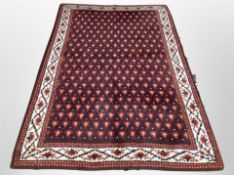 A Persian style wool rug,