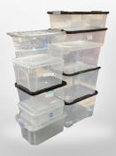 A group of plastic storage boxes with lids.