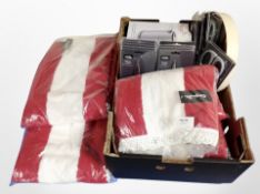 A box of new homewares including scissors, rugs, small circular drinks tray, a swan kettle.