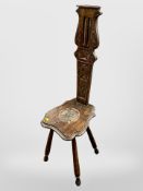 A 19th century carved oak spinning chair,
