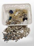 A basket containing a belt designed by Jasper Conran, further belt, costume jewellery, etc.