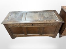 A George III panelled oak coffer,
