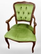 A beech framed salon armchair in dralon upholstery
