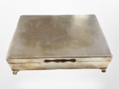 A silver-plated cigarette box, width 17cm.