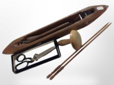 An antique wooden weaving shuttle, together with a further turned wooden mushroom spool,