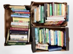 Three boxes of books relating to cricket.