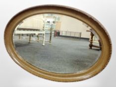 An oval bevelled mirror,