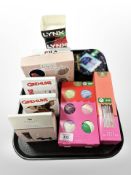 A tray containing cosmetics, bath fizzers, diffusers, socks.