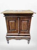 A Victorian oak miniature double-door apprentice cabinet, height 33cm.