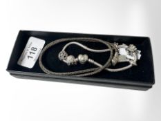 A Pandora bracelet with charms.