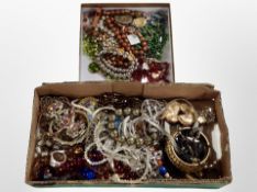 Two small trays of costume jewellery, prayer beads, crosses, crucifixes, etc.