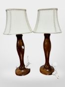 A pair of contemporary turned beech table lamps, with shades,
