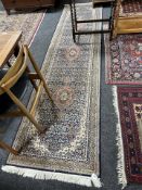 A machine made runner of Tabriz design,