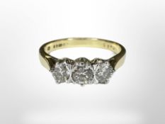 An 18ct gold three stone diamond ring, size CONDITION REPORT: 3.