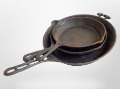 Three 19th century cast iron skillets, longest 45cm.