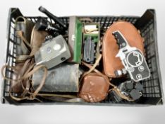 A collection of vintage cameras and handheld video cameras including Yashica, etc.