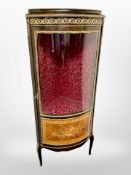 A French style kingwood and satinwood veneered bowfront corner vitrine, with gilt metal mounts,