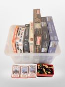 A box of assorted jigsaws, chess sets, Top Trumps.