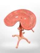 A painted metal adjustable tractor seat stool.