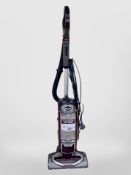 A Shark upright vacuum cleaner.
