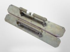 A pair of early-20th century brass door pull handles, length 61cm.