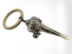 A silver and mother of pearl rattle, length 15.
